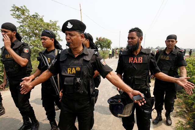 Security personnel from the elite Rapid Action Battalion (RAB), who made the arrests