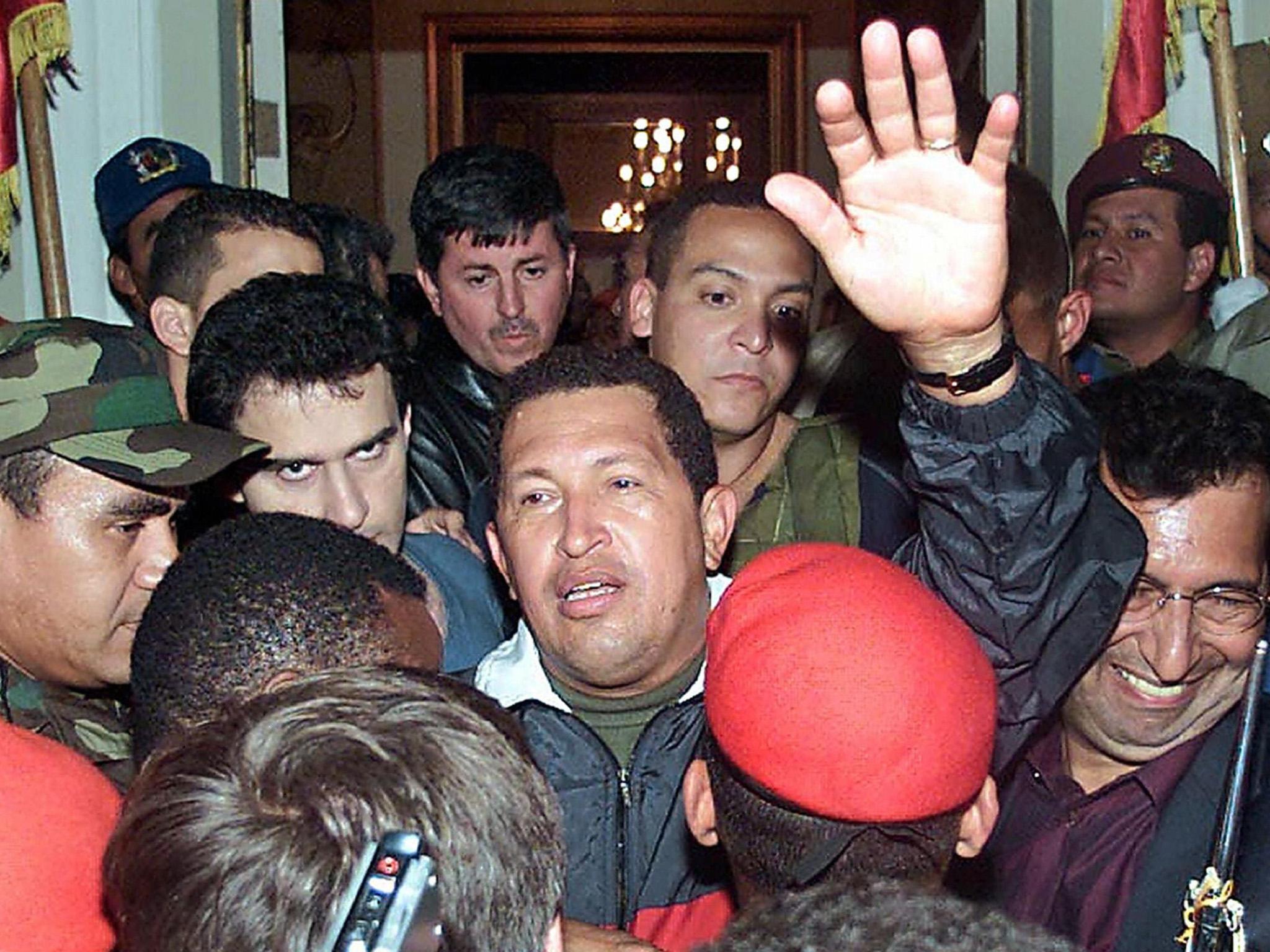 Hugo Chavez greeted by supporters upon his return to the presidential palace after the failed putsch against him in 2002