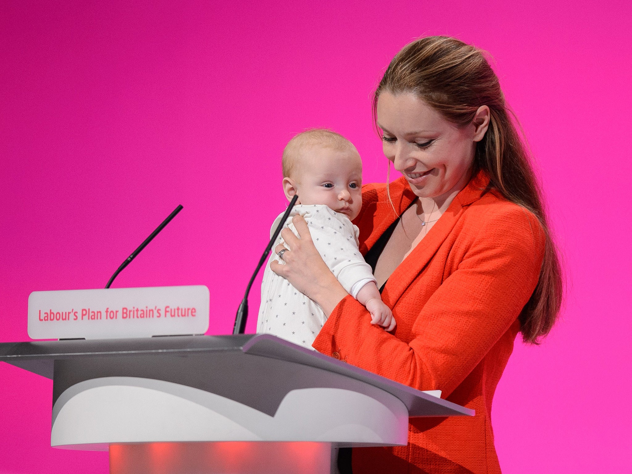 Catherine Atkinson, pictured with her then 3-month-old son in 2014, was confronted by a Tory councillor over her suitability to be an MP while pregnant with her second child