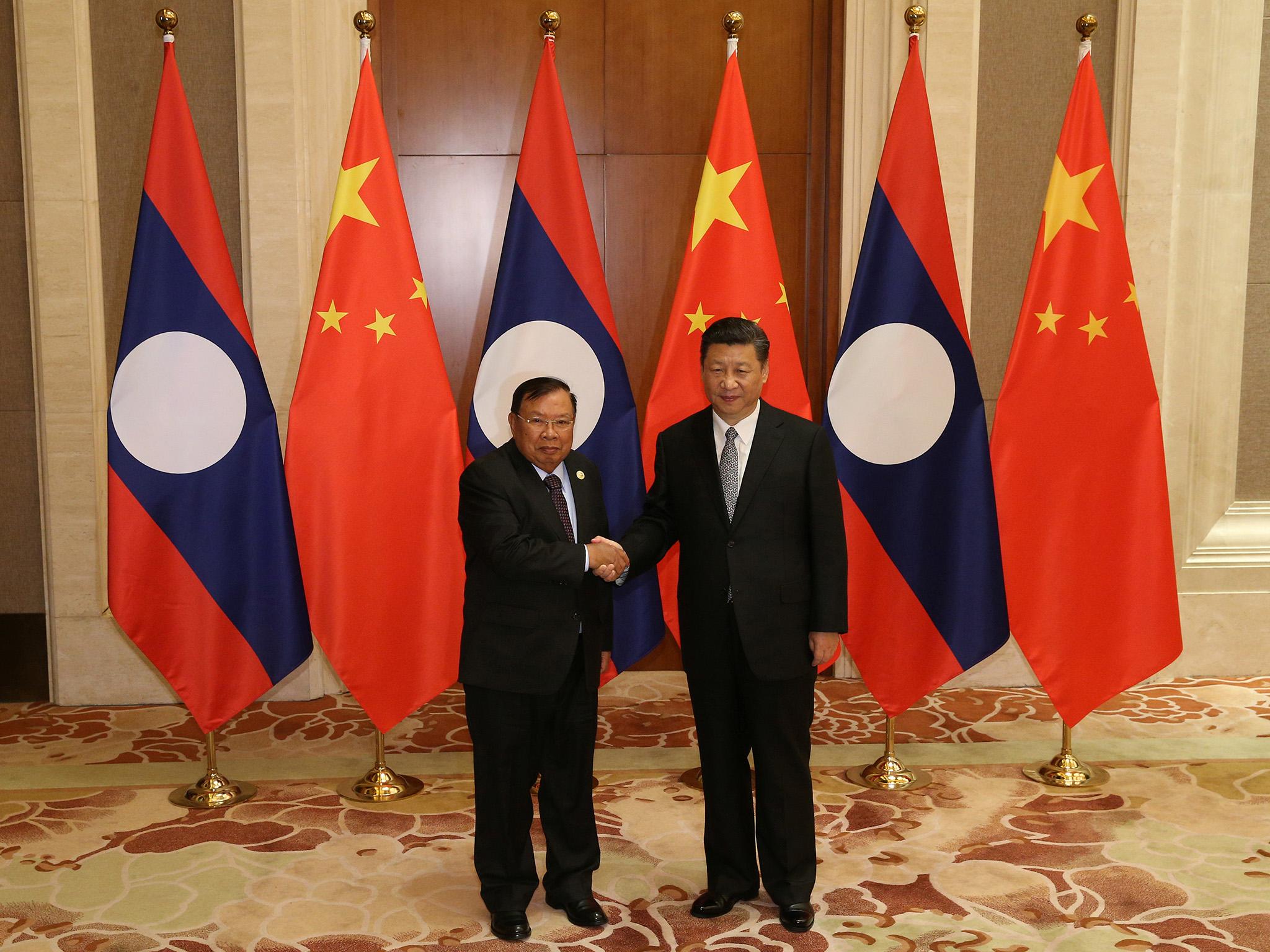 Laos’s President Bounnhang Vorachith (left) and Chinese President Xi Jinping before a bilateral meeting at Diaoyutai State Guesthouse earlier this month