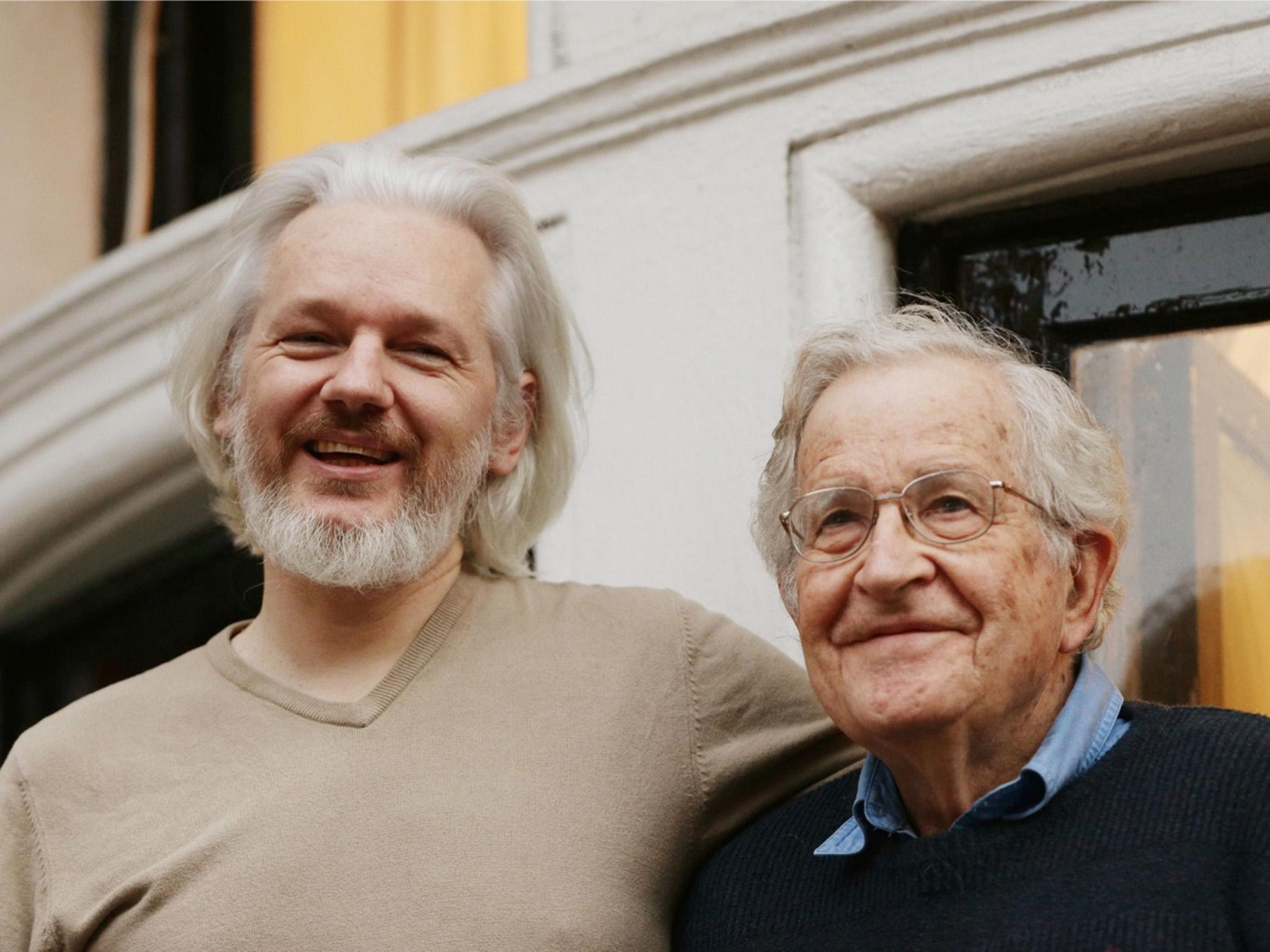 Assange and Chomsky on a balcony of the Ecuadorian embassy