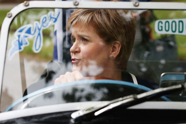 First Minister and SNP leader Nicola Sturgeon sits in the driving seat of a  Midge car during a visit to Moffat on the General Election campaign trail