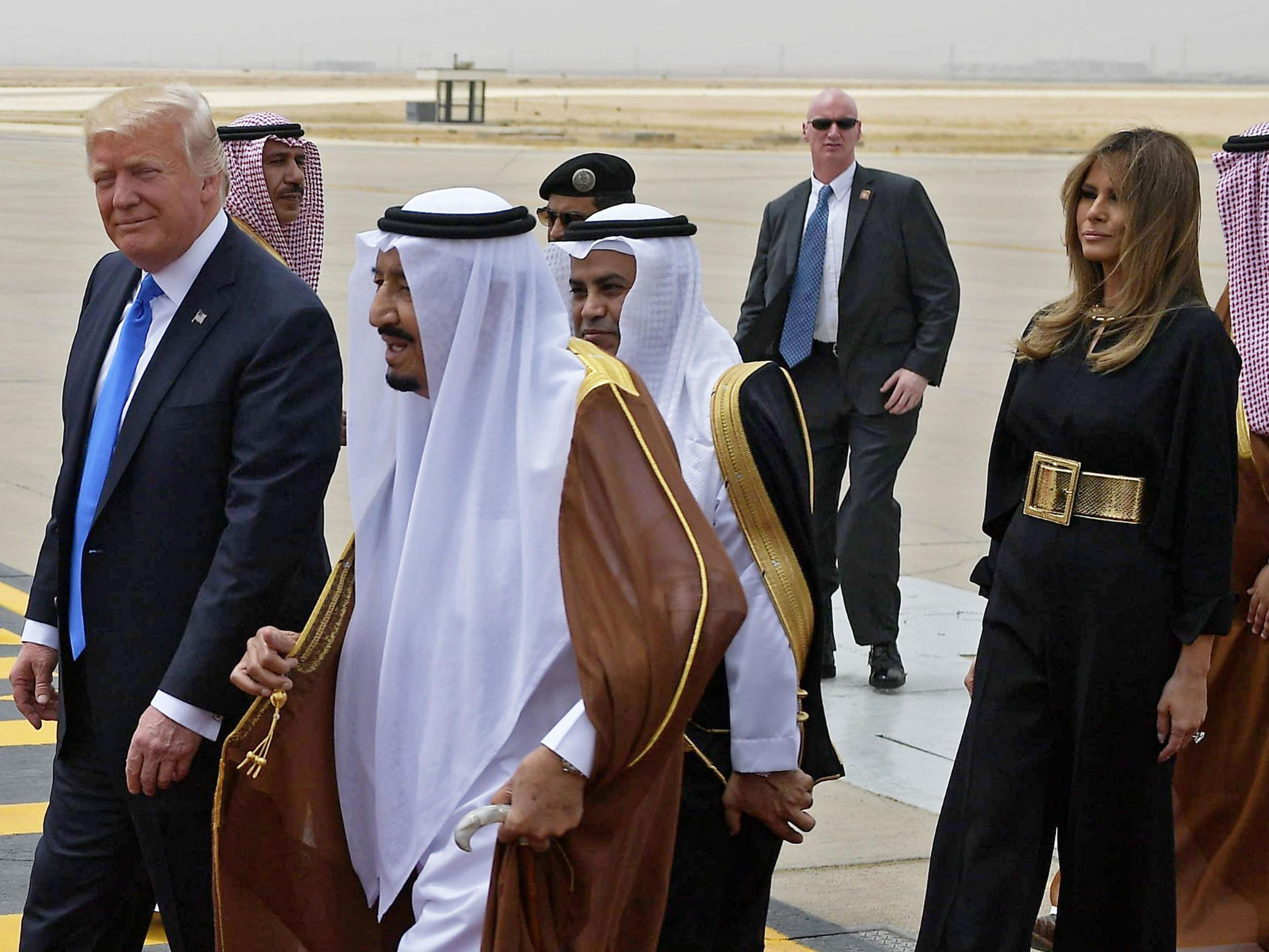 Donald Trump is welcomed by Saudi King Salman bin Abdulaziz al-Saud after arriving in Riyadh with his wife Melania