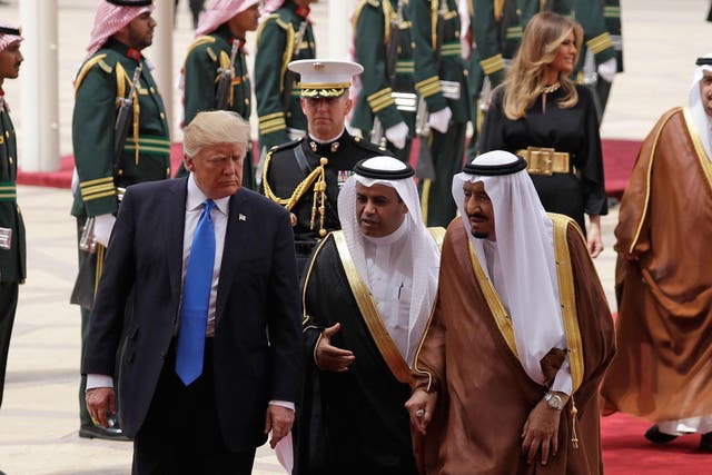 President Donald Trump and first lady Melania Trump arrive at the Royal Terminal of King Khalid International Airport/
