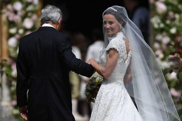 Pippa Middleton is escorted into the church by her father