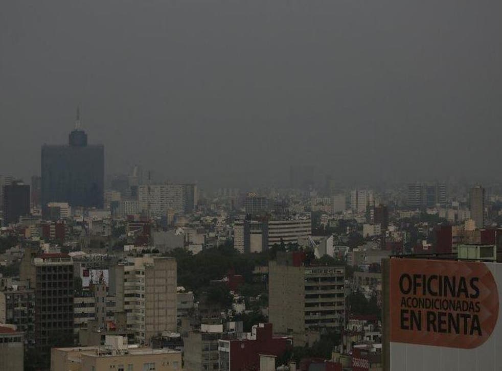 Murky skies and high ozone levels have led authorities Mexico City to ban thousands of cars from the road
