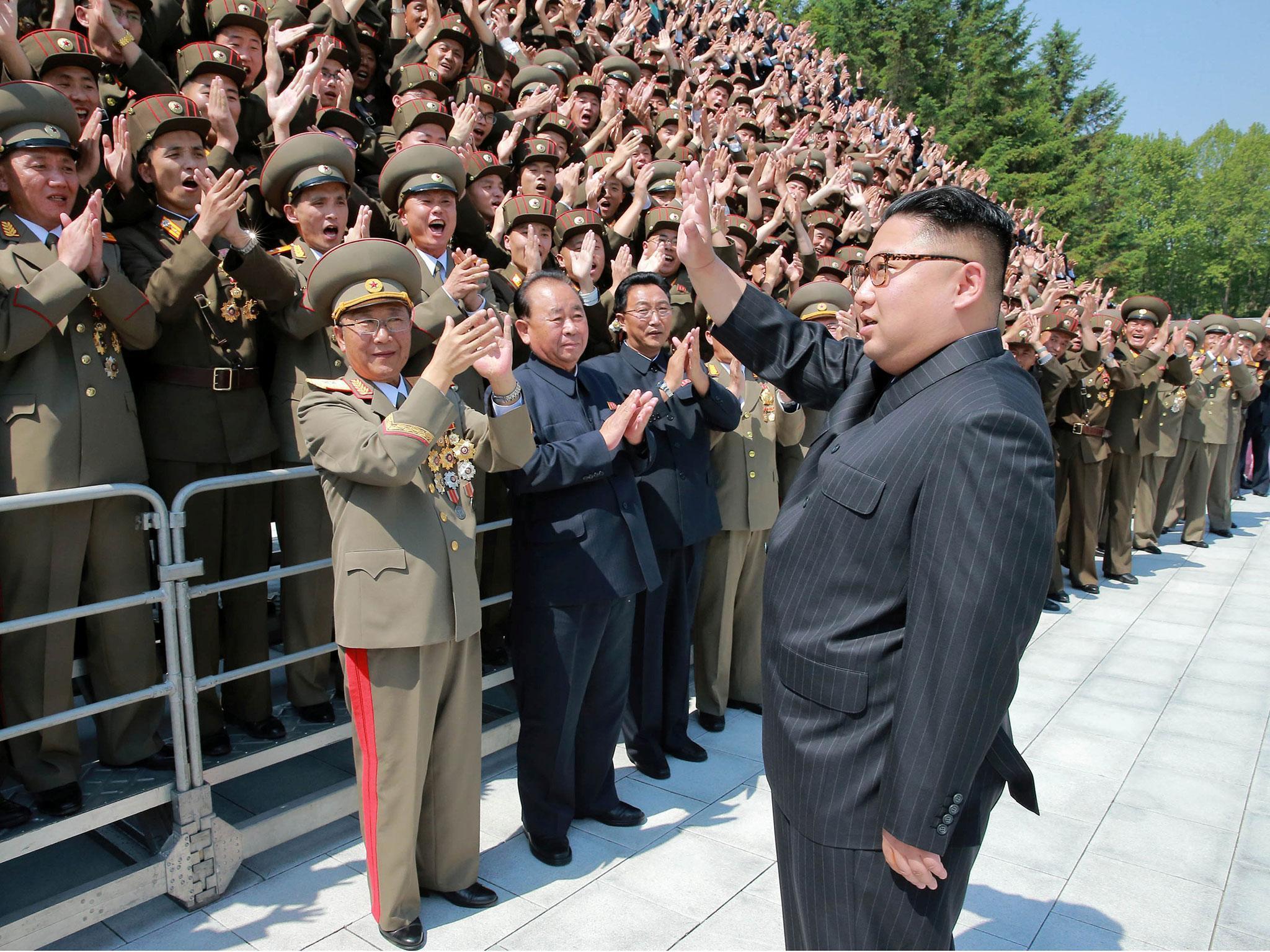 Kim Jong-un acknowledges North Korean scientists and technicians who developed the Hwasong-12 missile