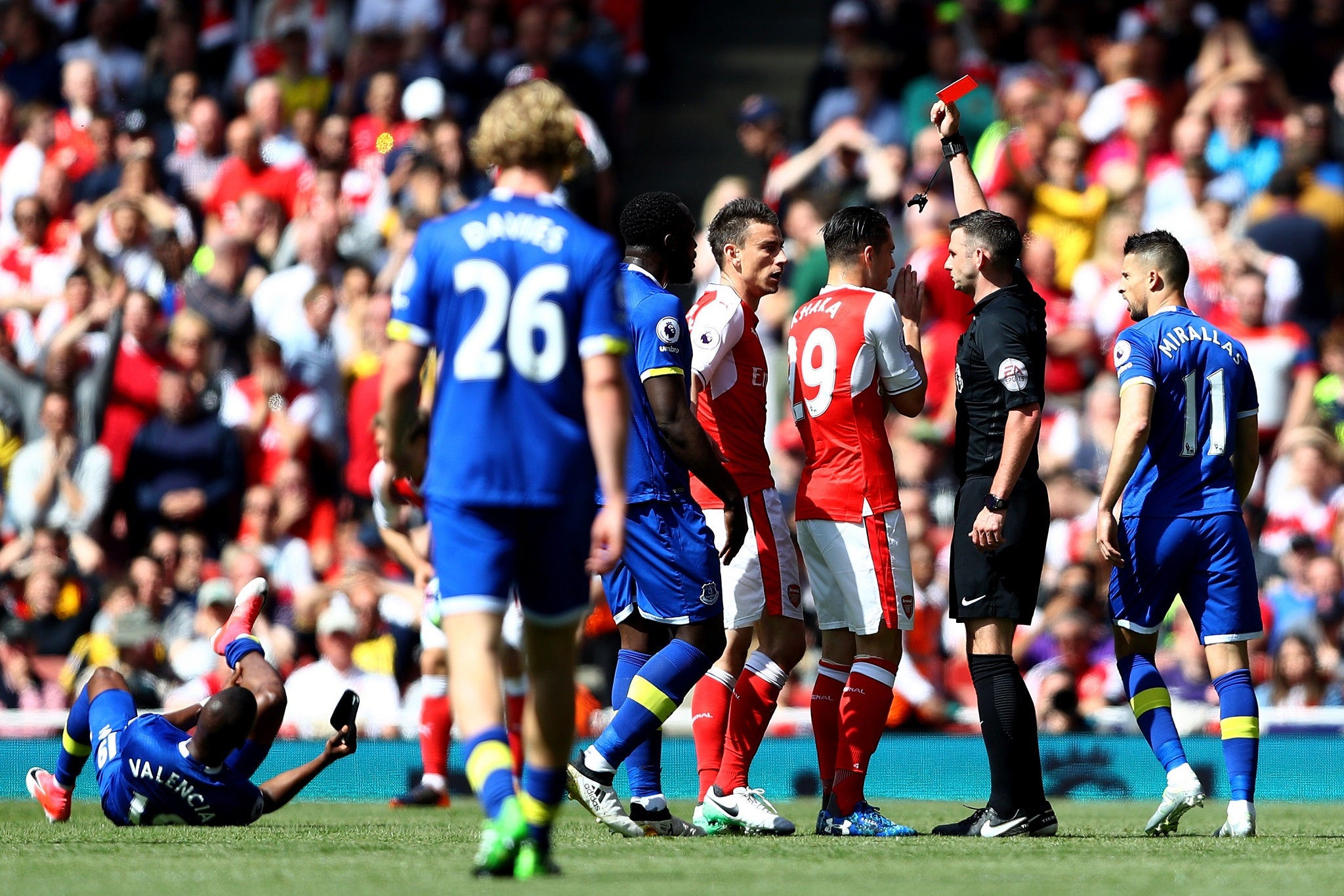 Laurent Koscielny is shown a red card for his tackle on Enner Valencia by Michael Oliver