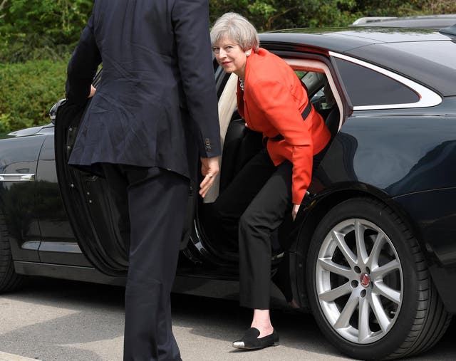 Theresa May arrives at an election campaign event in Wrexham