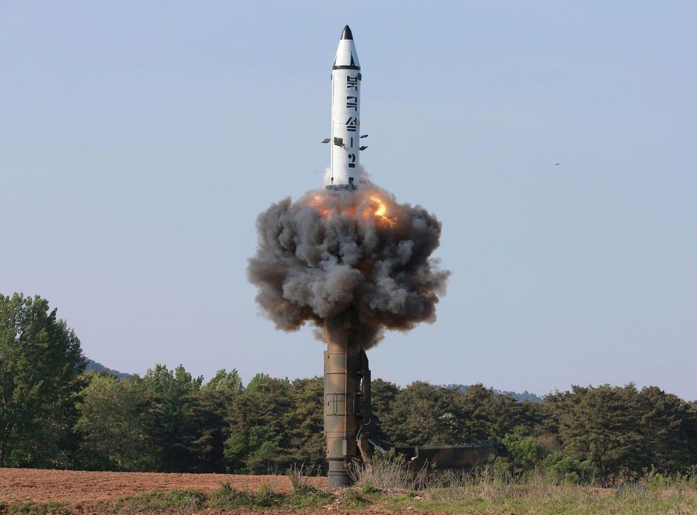 North Korea test fires medium-range ballistic missile Pukguksong-2, which flew about 500km (310 miles) and reached a height of 560km (350 miles) before plunging into the Pacific Ocean