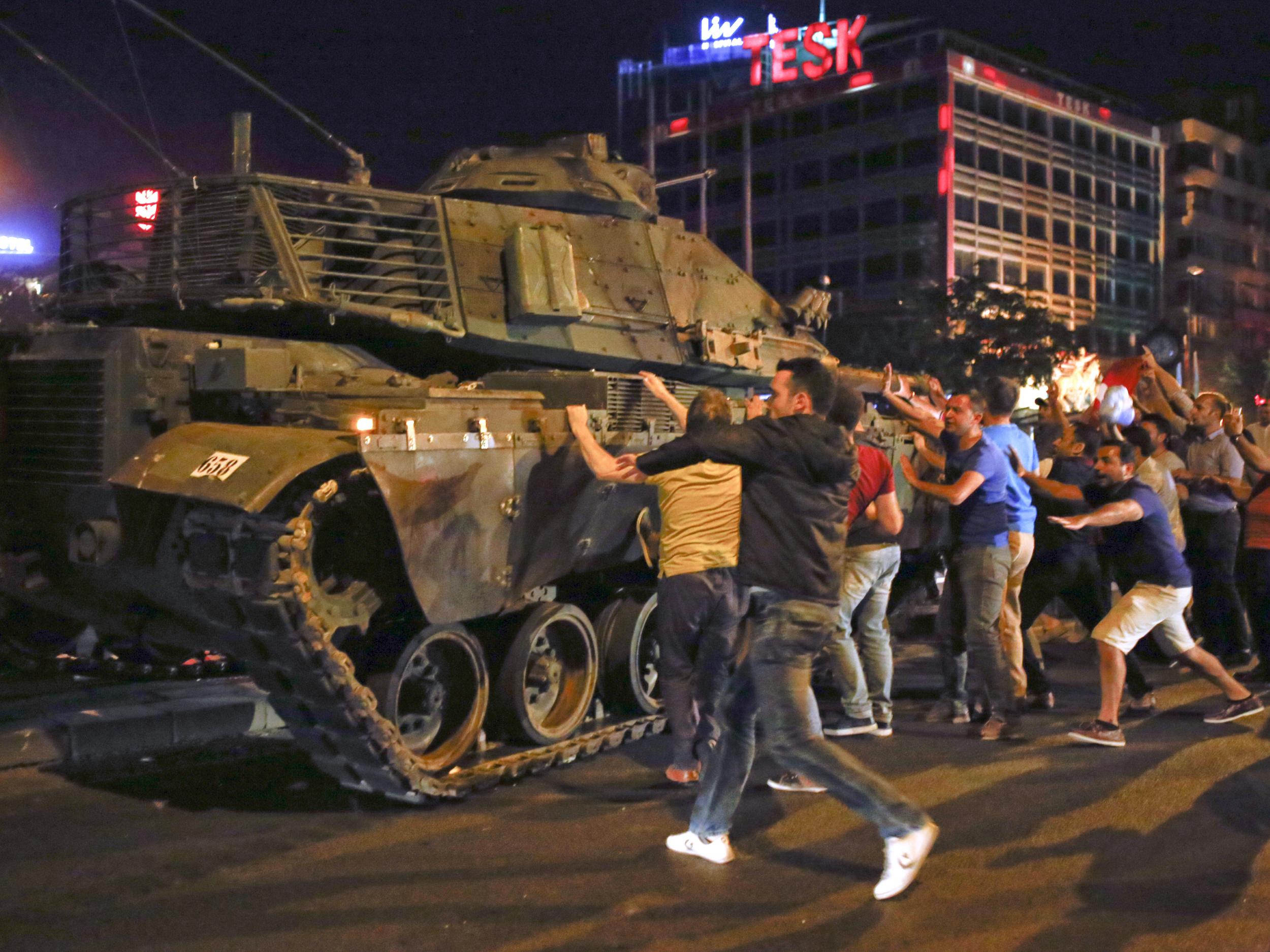 Protesters face off against a tank on the streets of Ankara during the night of the failed coup last July