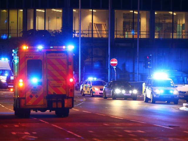 Emergency services arrive  close to the Manchester Arena on May 23, 2017 in Manchester, England