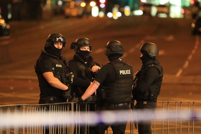Armed police at Manchester Arena after an explosion at the venue during an Ariana Grande gig