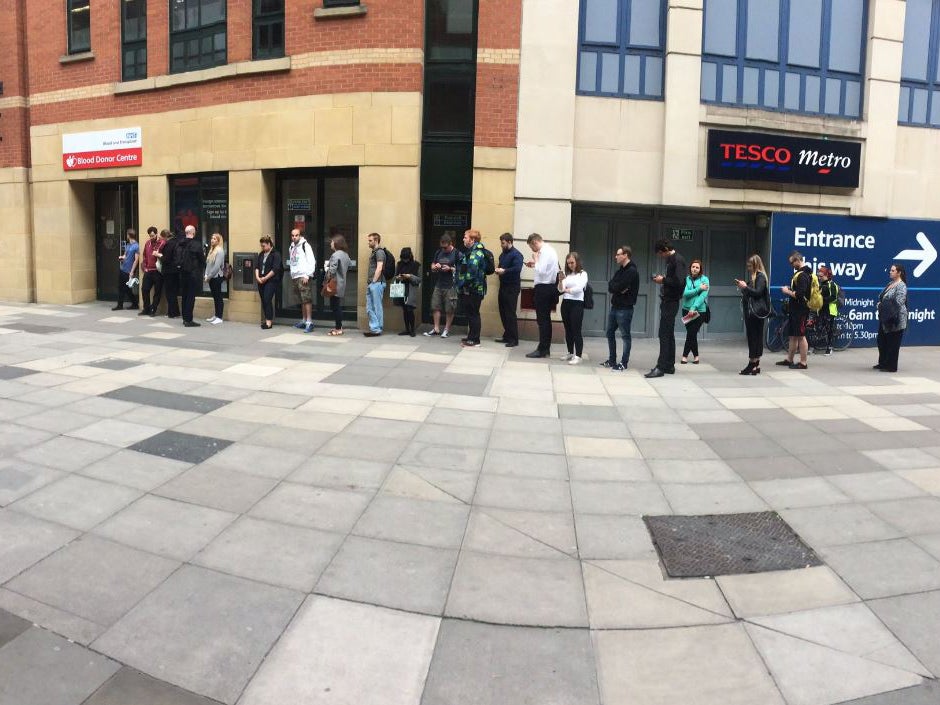 People queue to give blood at a donation centre in Manchester the morning after the attac