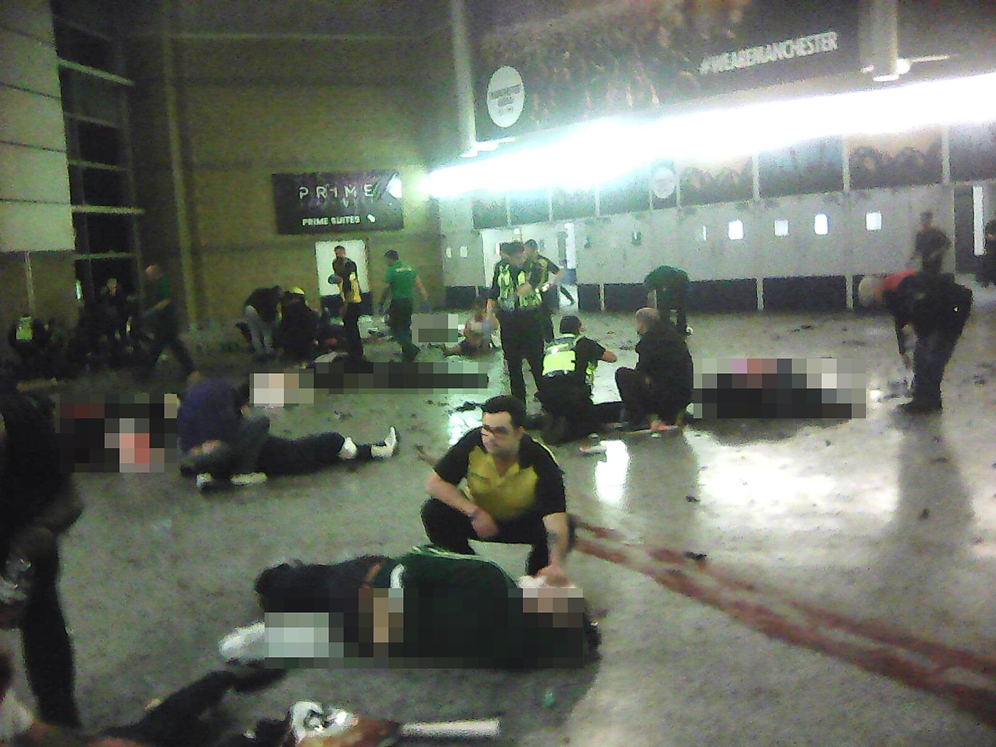 Paramedics attend to casualties inside Manchester Arena after Salman Abedi detonated his bomb