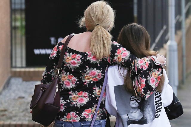 Ariana Grande concert attendees Karen Moore and her daughter Molly Steed, aged 14, from Derby,  leave the Park Inn where they were given refuge after last night's explosion at Manchester Arena