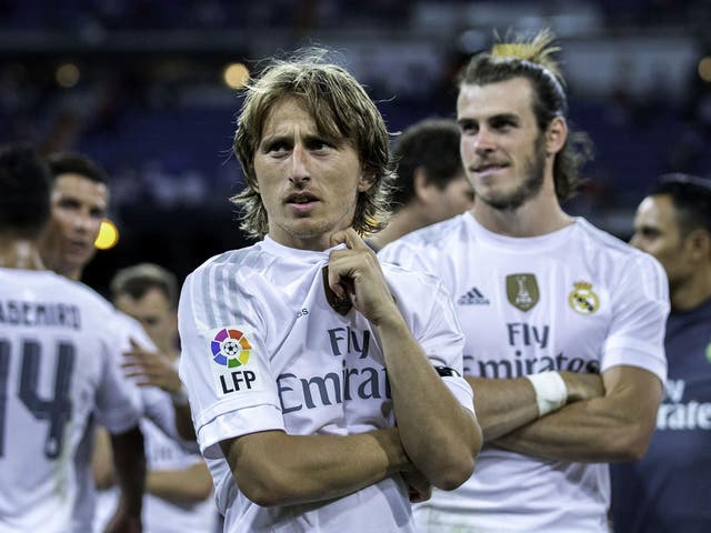Modric and Bale were both waiting patiently for the trophy presentation