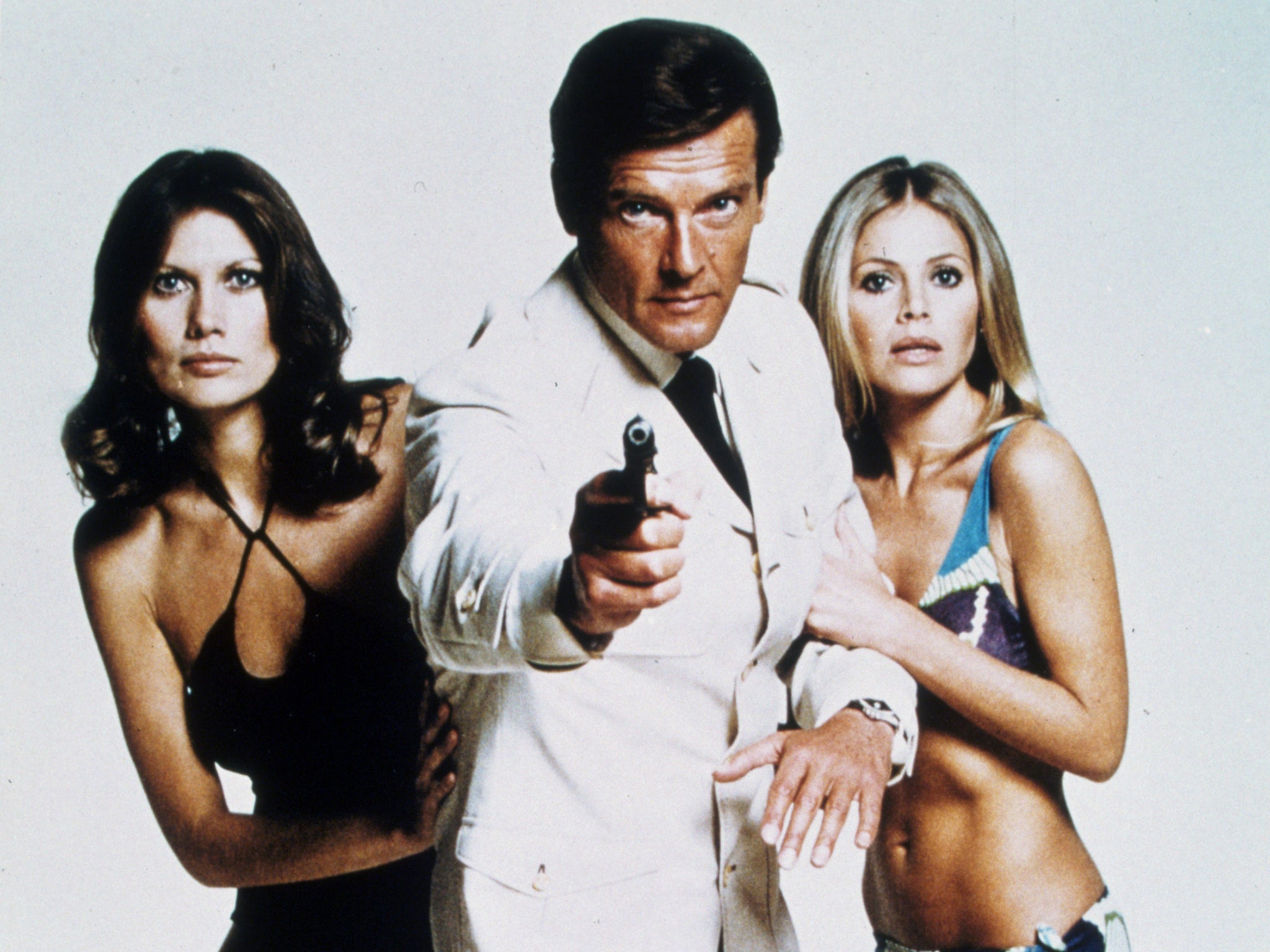 Double-oh heaven: Roger Moore – and Bond girls – in 1974’s The Man With the Golden Gun