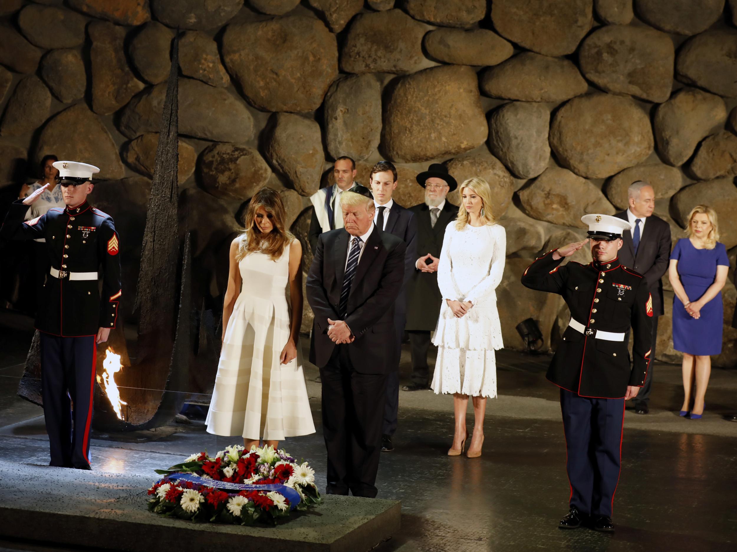 White House senior adviser Jared Kushner, Ivanka Trump, First Lady Melania Trump, US President Donald Trump, Israel's Prime Minister Benjamin Netanyahu, his wife Sara and Chairman of the Yad Vashem Holocaust Memorial, Avner Shalev, attend a wreath laying ceremony during a visit to the museum in Jerusalem