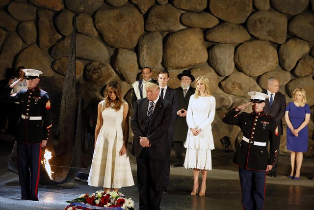 White House senior adviser Jared Kushner, Ivanka Trump, First Lady Melania Trump, US President Donald Trump, Israel's Prime Minister Benjamin Netanyahu, his wife Sara and Chairman of the Yad Vashem Holocaust Memorial, Avner Shalev, attend a wreath laying ceremony during a visit to the museum in Jerusalem