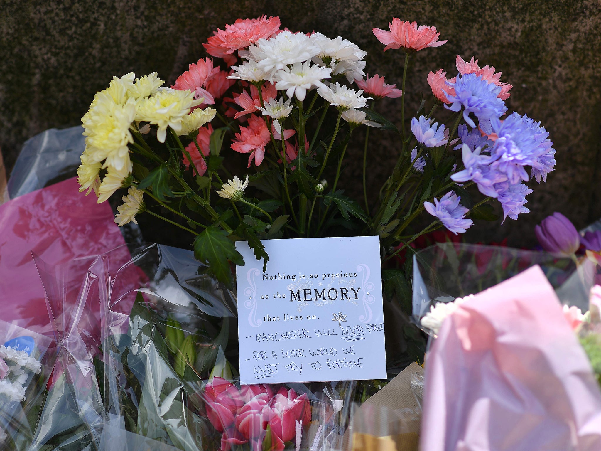 Floral tributes are arriving at the scene in Manchester, where 22 people have been confirmed to have lost their lives