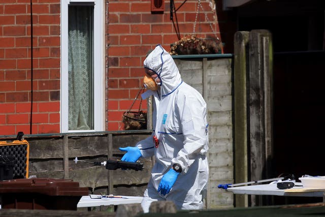A police forensic investigator at Salman Abedi's address in Elsmore Road, Greater Manchester, on 23 May
