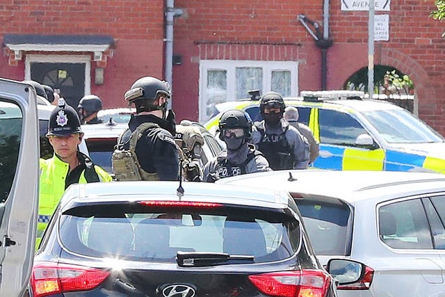 Police at the Abedis' family home following the bombing