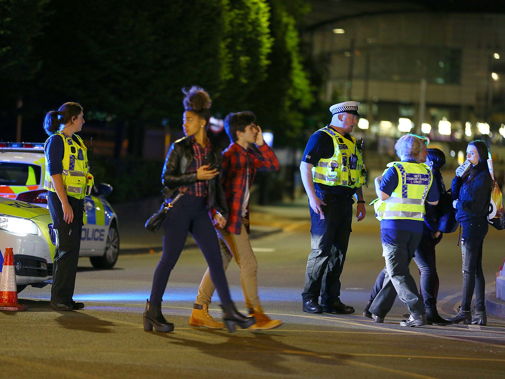 Concert-goers flee the Manchester Arena after an attack on Monday evening, which left 22 dead and 59 injured