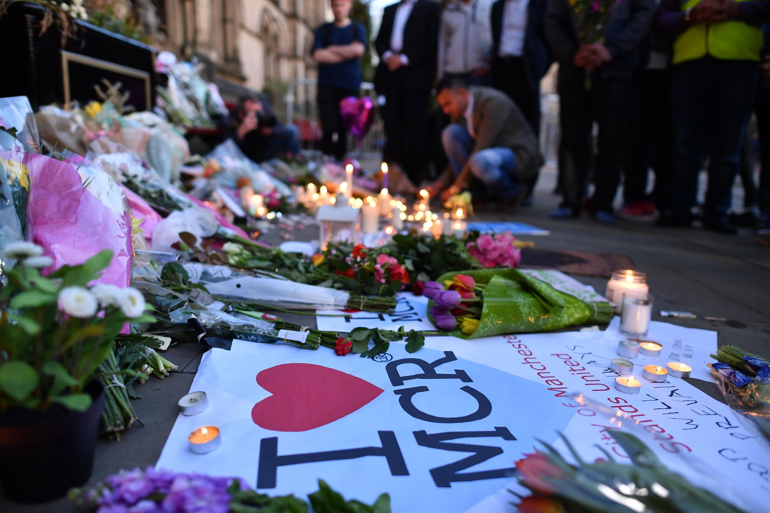 Cities around the world lit up monuments in remembrance of Manchester victims