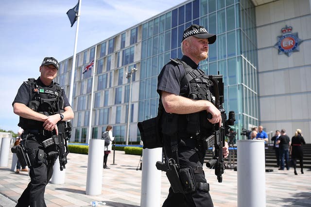 Armed police guard Greater Manchester Police station