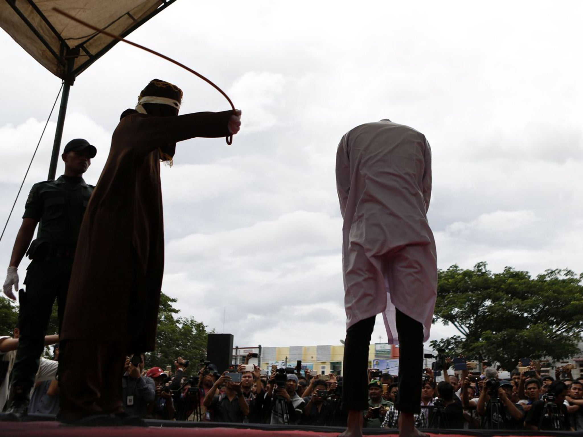 &#13;
A man is caned in the Indonesian region of Banda Aceh for having gay sex &#13;