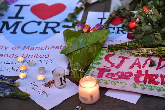 Messages and floral tributes left in Albert Square in Manchester, in solidarity with those killed and injured in the terror attack at the Ariana Grande concert at Manchester Arena