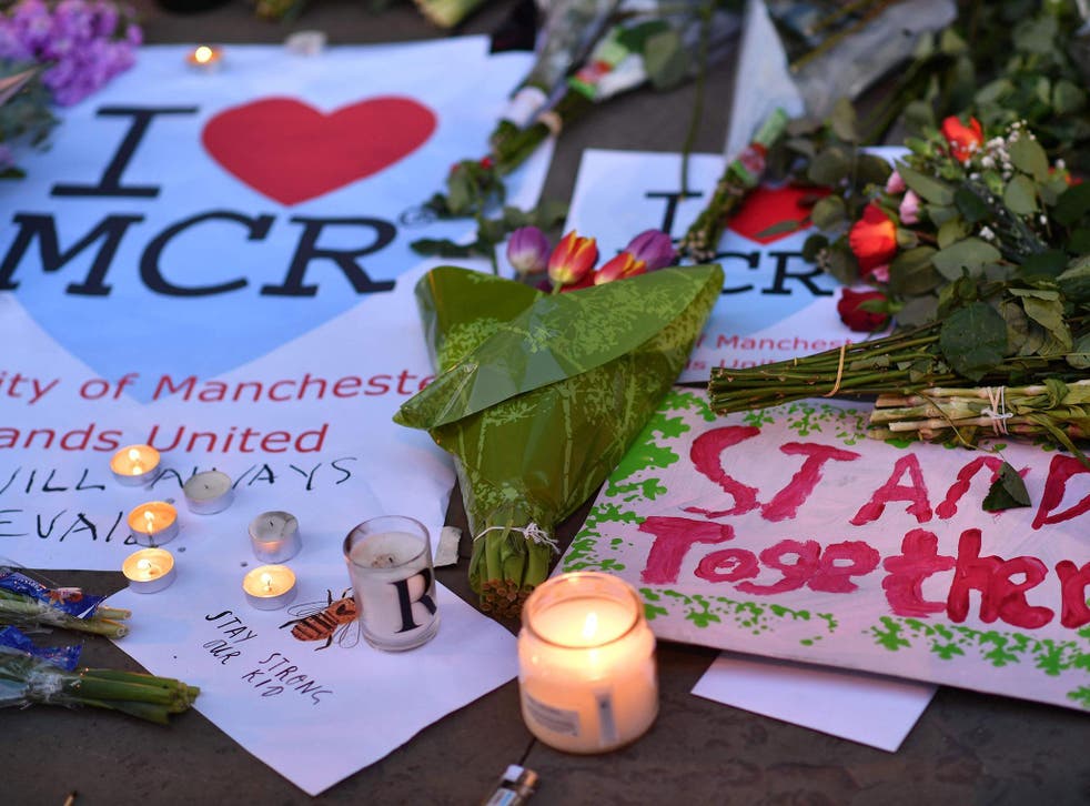 Messages and floral tributes left in Albert Square in Manchester, in solidarity with those killed and injured in the terror attack at the Ariana Grande concert at Manchester Arena