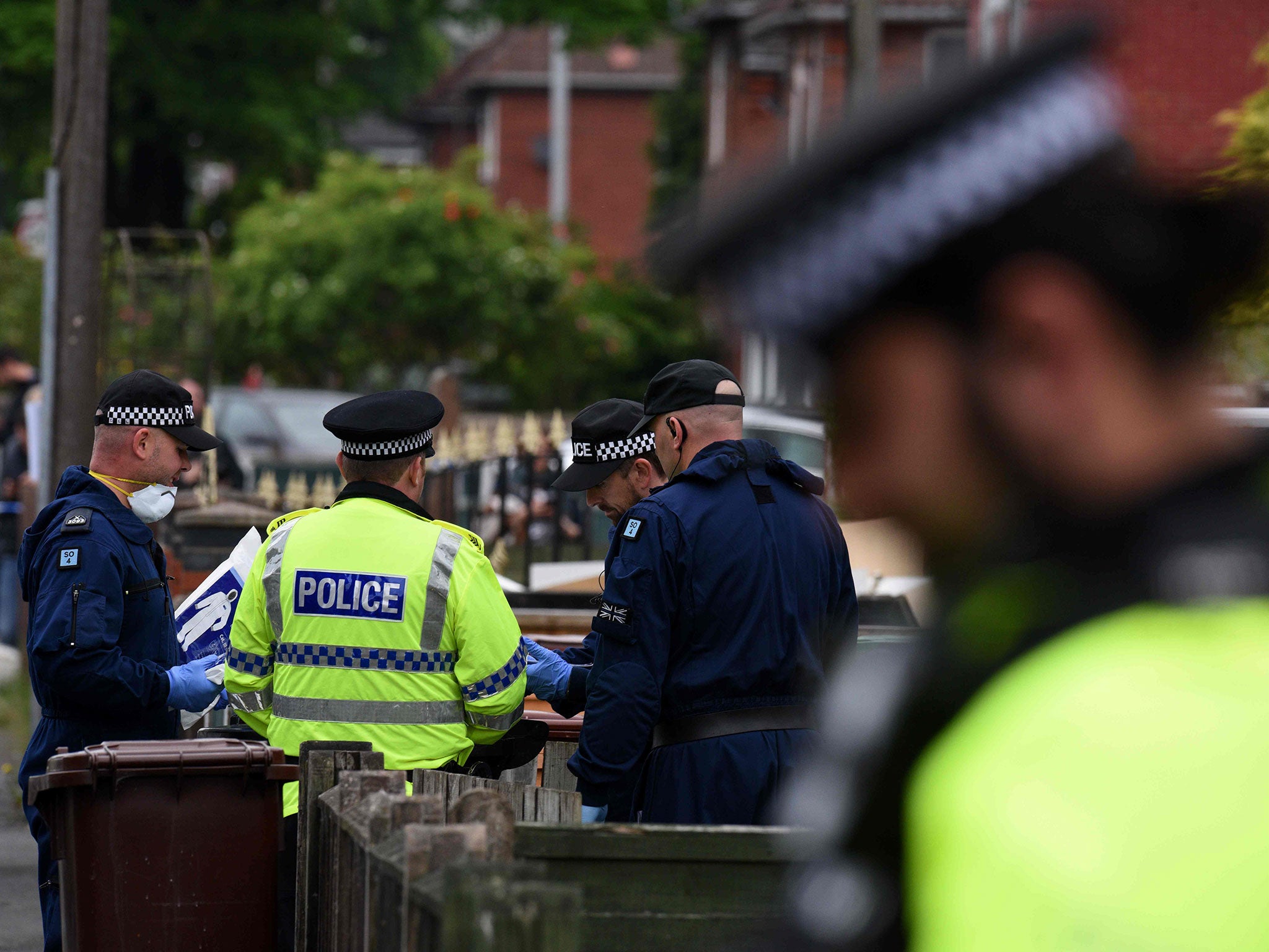 Police officers arrive at a residential property on Elsmore Road in Fallowfield, Manchester, on May 24, 2017,