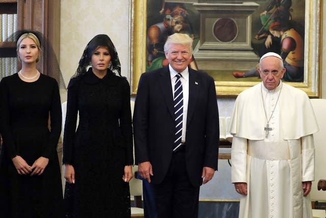 Pope Francis poses with US President Donald Trump, First Lady Melania Trump and the daughter of Ivanka Trump at the end of a private audience at the Vatican