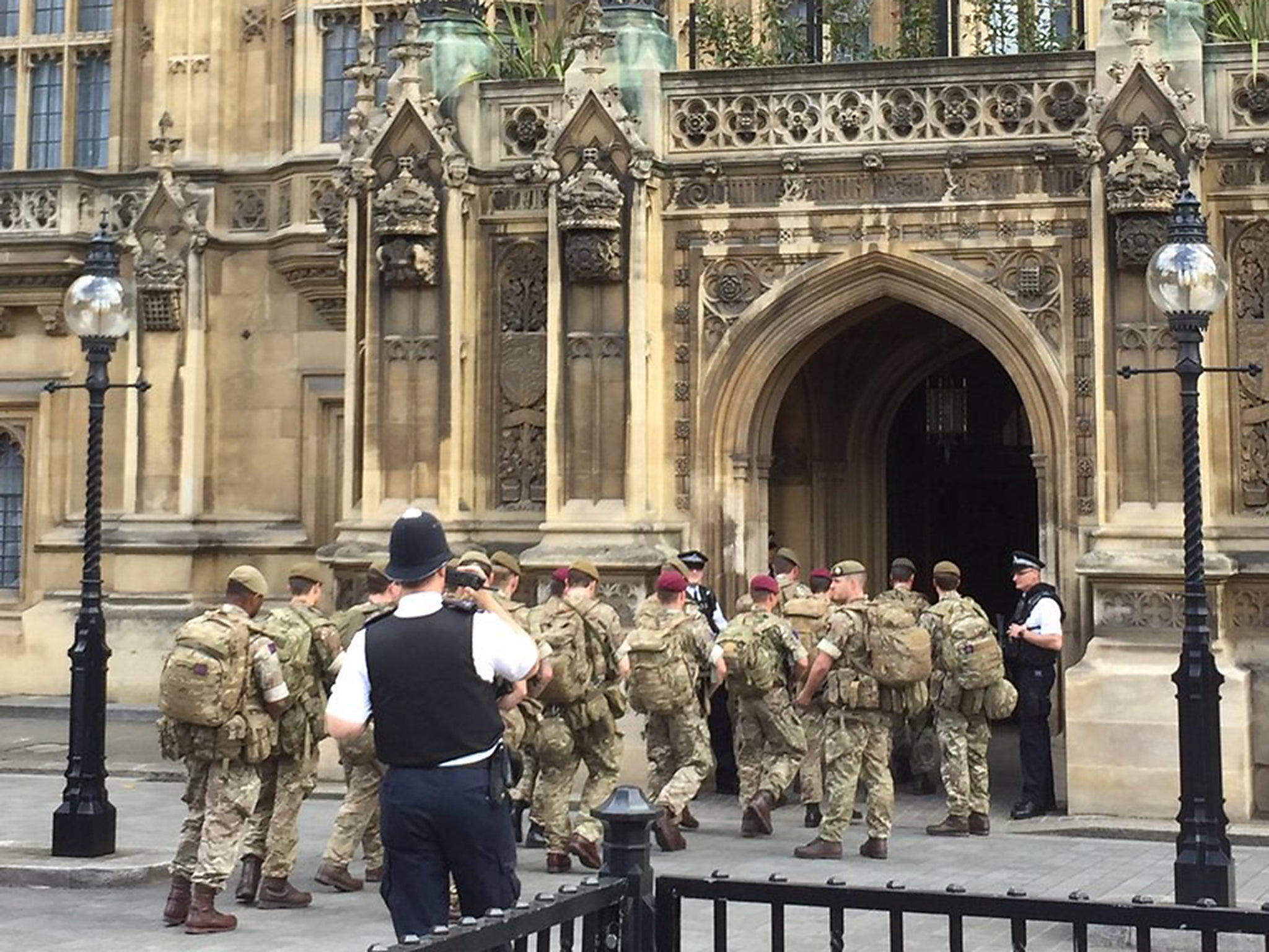 Armed troops march into the Houses of Parliament