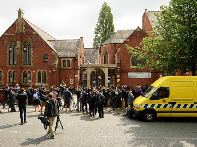 Members of the media congregate outside of Didsbury Mosque in Didsbury, Manchester, northwest England