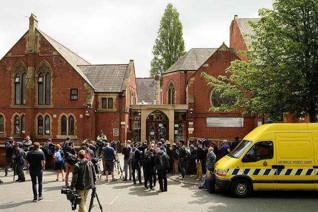 Members of the media congregate outside of Didsbury Mosque in Didsbury, Manchester, northwest England