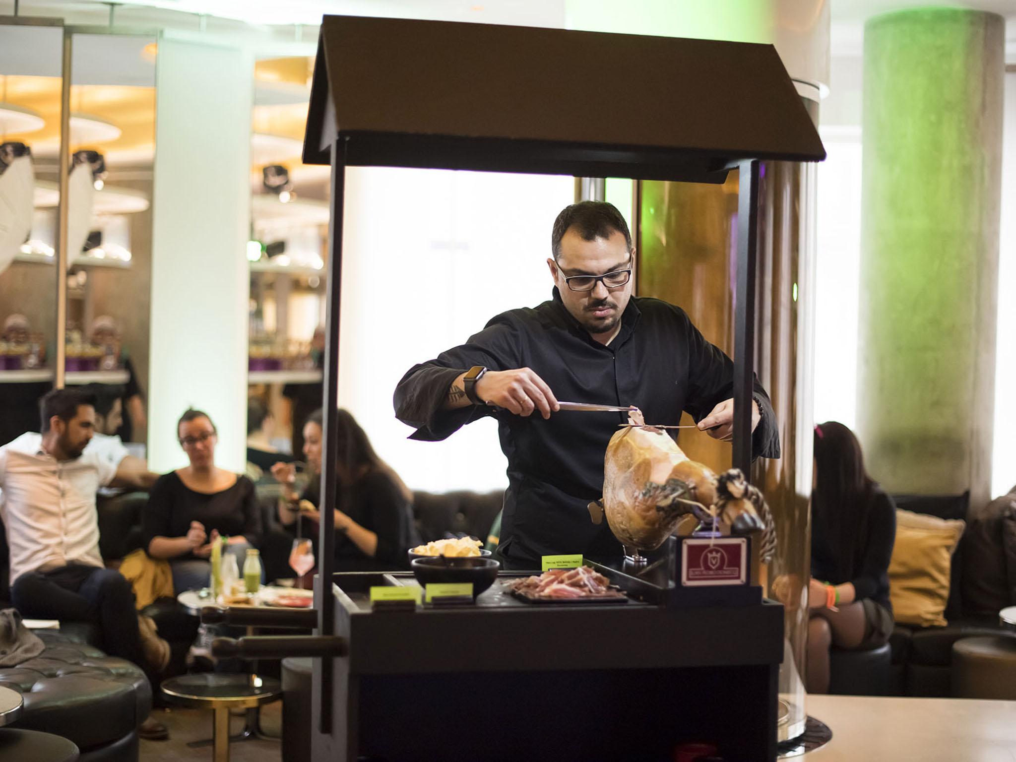 The iberico ham station is fun to watch in action