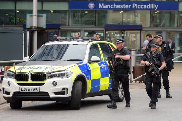 Armed police patrolling Manchester Piccadilly station following the suicide attack