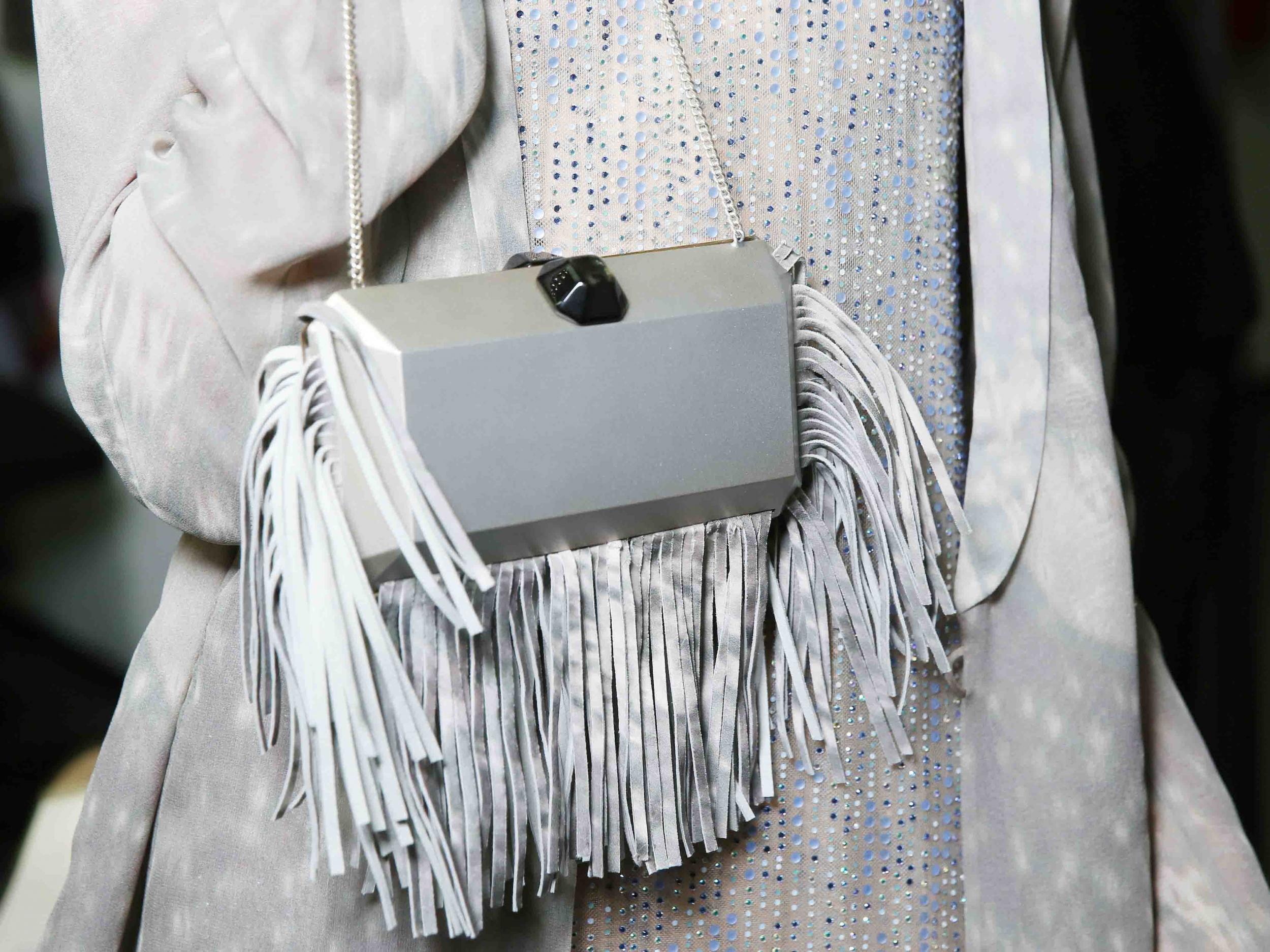 At Giorgio Armani, fringing accessorised everything from graphic dresses to clutch bags