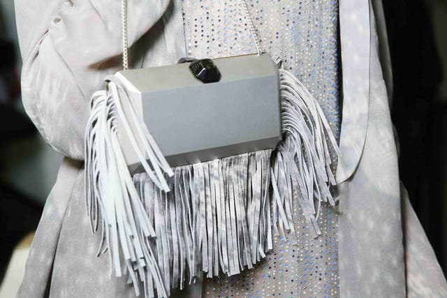 At Giorgio Armani, fringing accessorised everything from graphic dresses to clutch bags