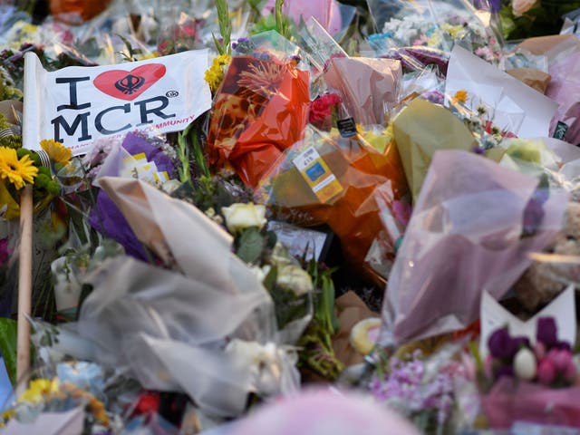 Flowers, messages and candles are pictured in St Ann's Square in Manchester in tribute to the victims of the 22 May terror attack