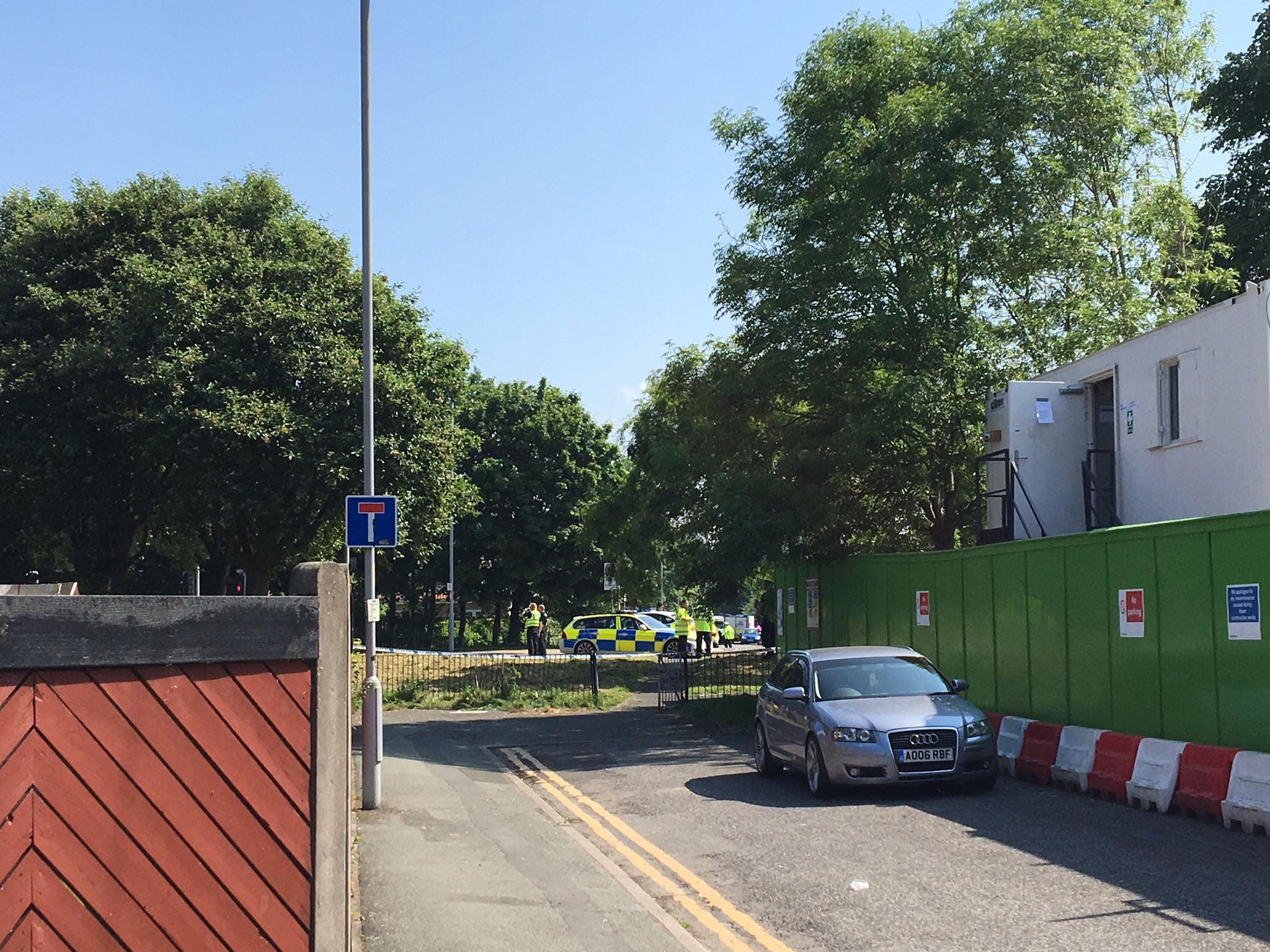 Police at a school in Hulme, Manchester, following an alert