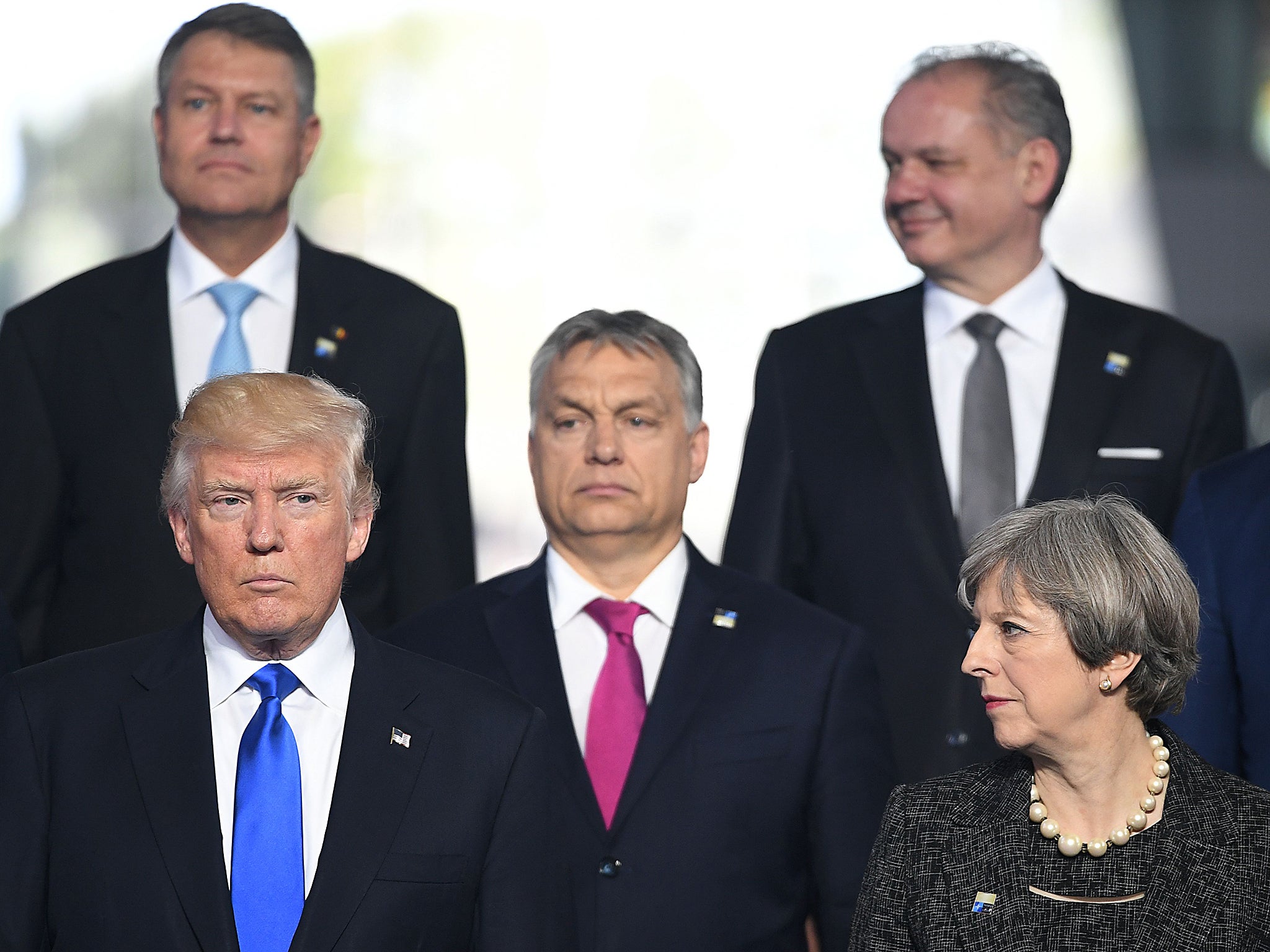US President Donald Trump, Hungarian Prime Minister Viktor Orban and British Prime Minister Theresa May, pose for a picture during the NATO (North Atlantic Treaty Organization) summit at the NATO headquarters, in Brussels