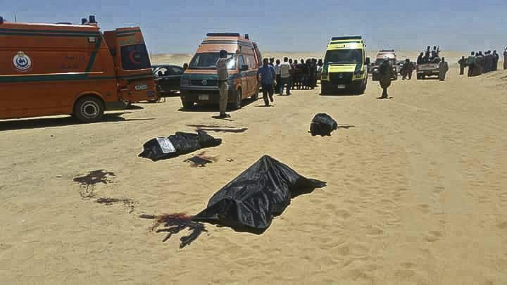Dead bodies lay covered in black plastic sheets in the aftermath of the attack