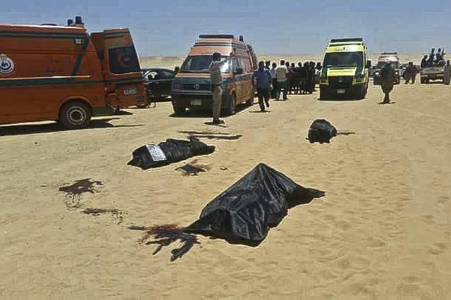 Dead bodies lay covered in black plastic sheets in the aftermath of the attack  