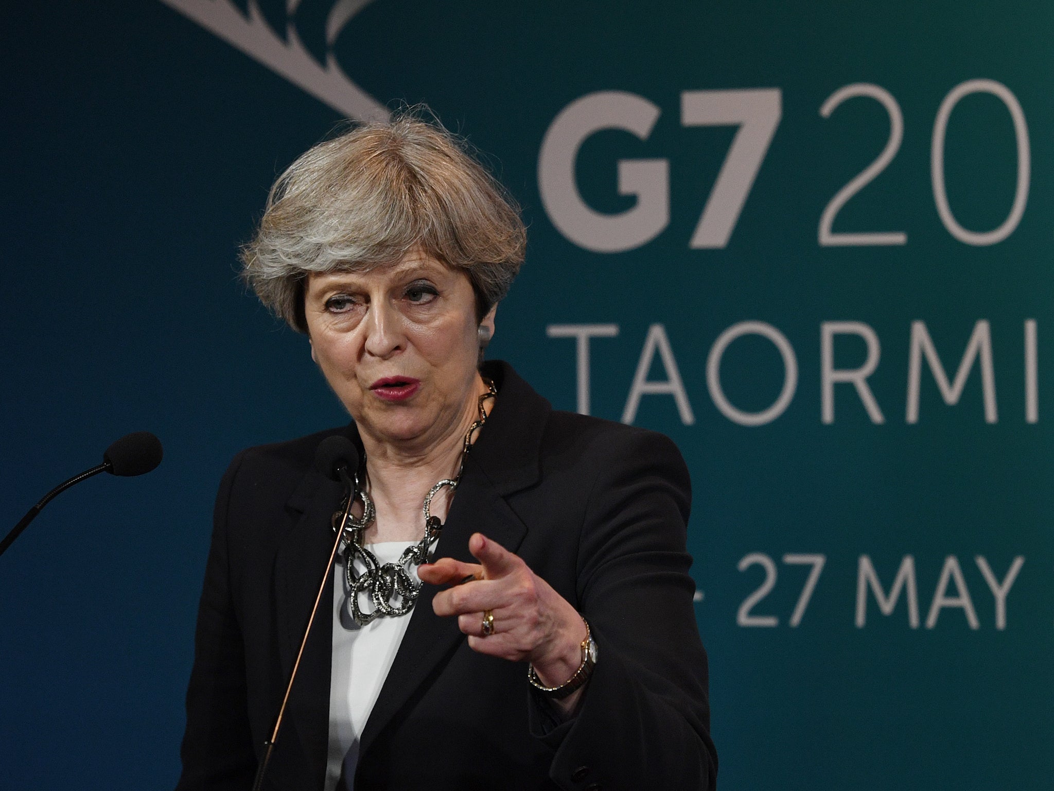 Prime Minister Theresa May speaks during a press conference at the G7 summit