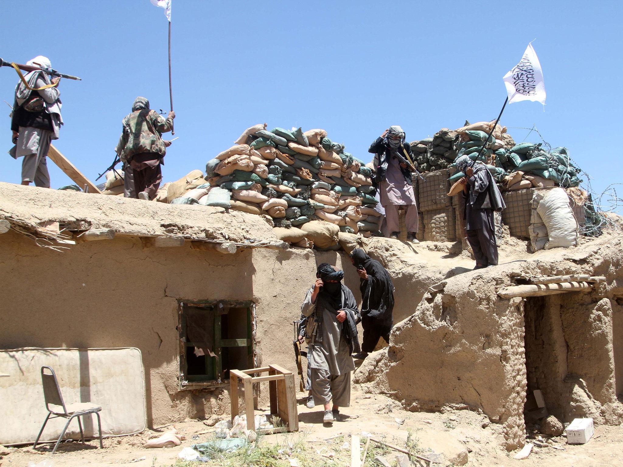 Suspected Taliban militants on patrol