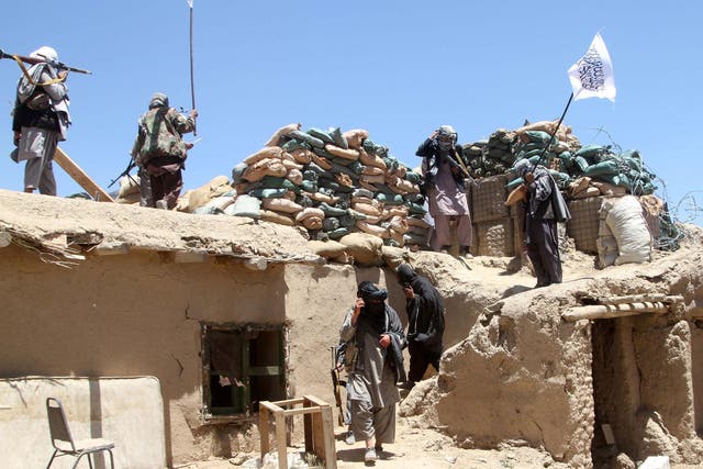 Suspected Taliban militants on patrol 